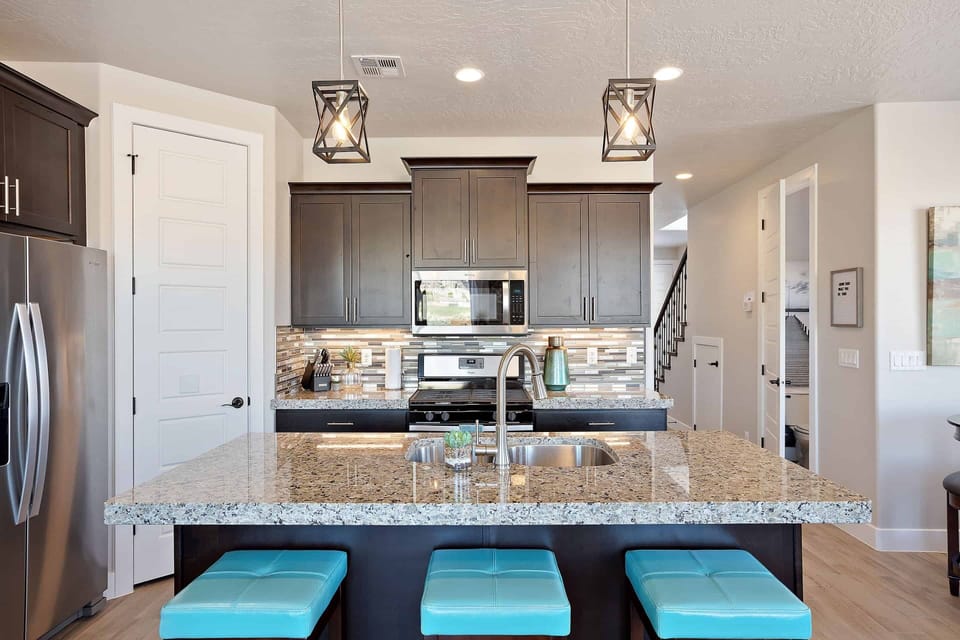 Kitchen Area - The Kitchen is complete with everything you will need for meal preparations including pots, pans, baking dishes, plates, cups, silverware, cutlery, and an assortment of cooking utensils.