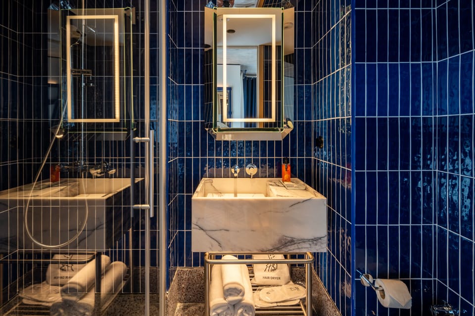 Shower, free toiletries, hair dryer, slippers