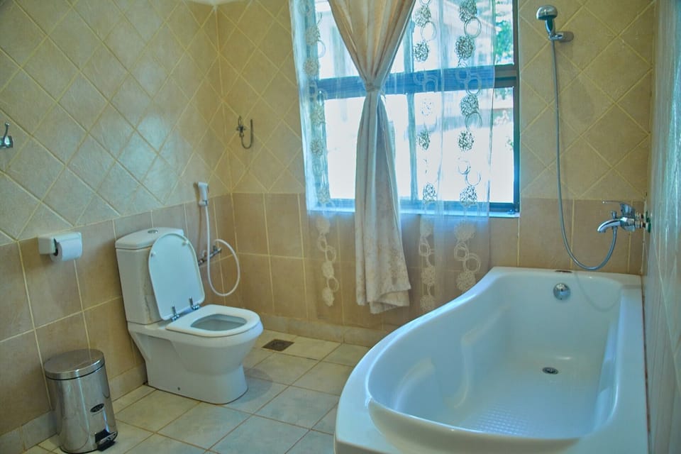 Separate tub and shower, rainfall showerhead, free toiletries, bathrobes