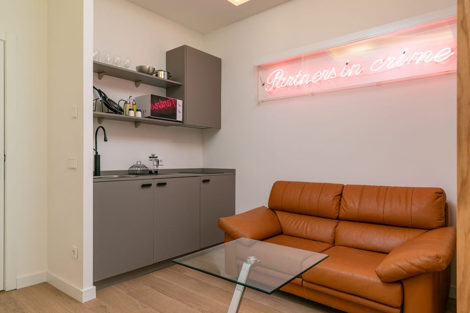 Living area with sofa and kitchen