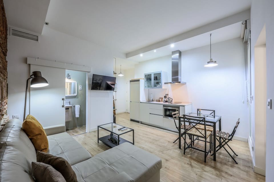 View of the living room space, dining room space and kitchen