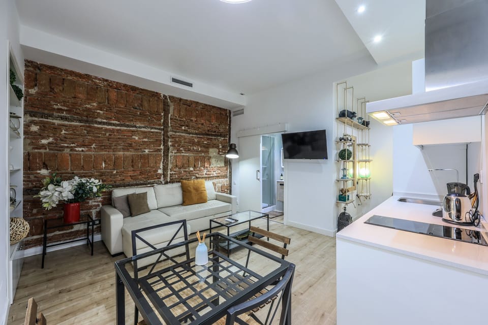 View of the living room space, dining room space and kitchen