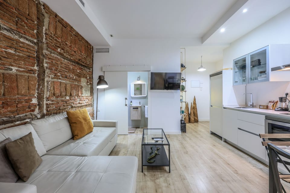 View of the living room space, dining room space and kitchen