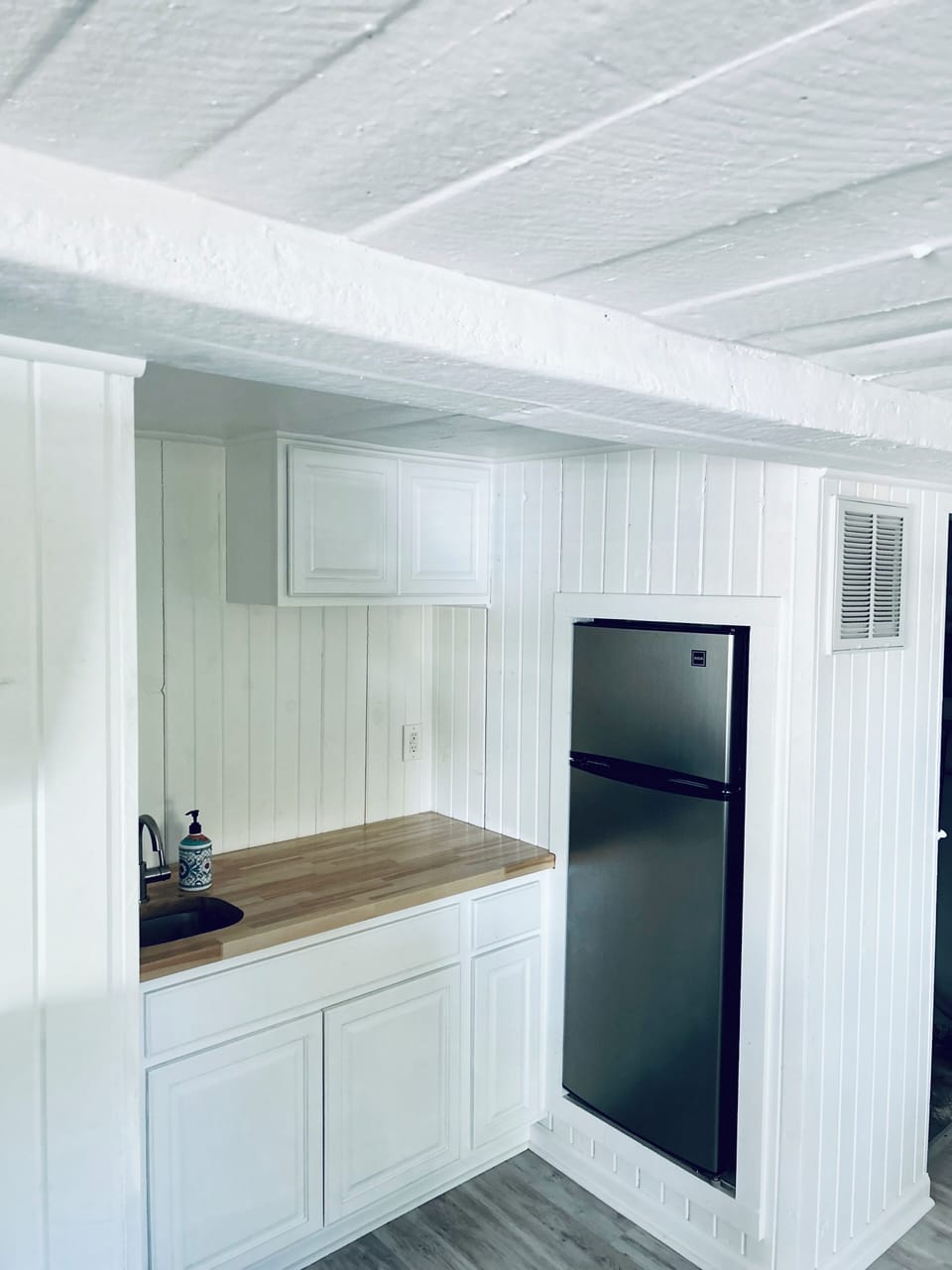Lower level studio apartment kitchenette 