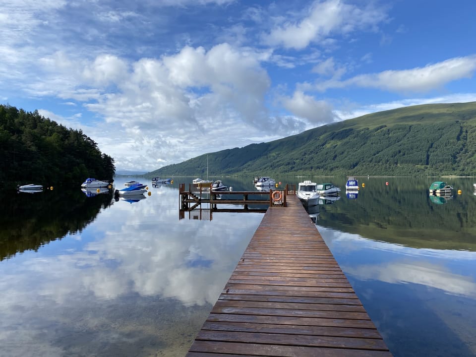 Loch Lomond with jetty where you can dock boats and jet skis 