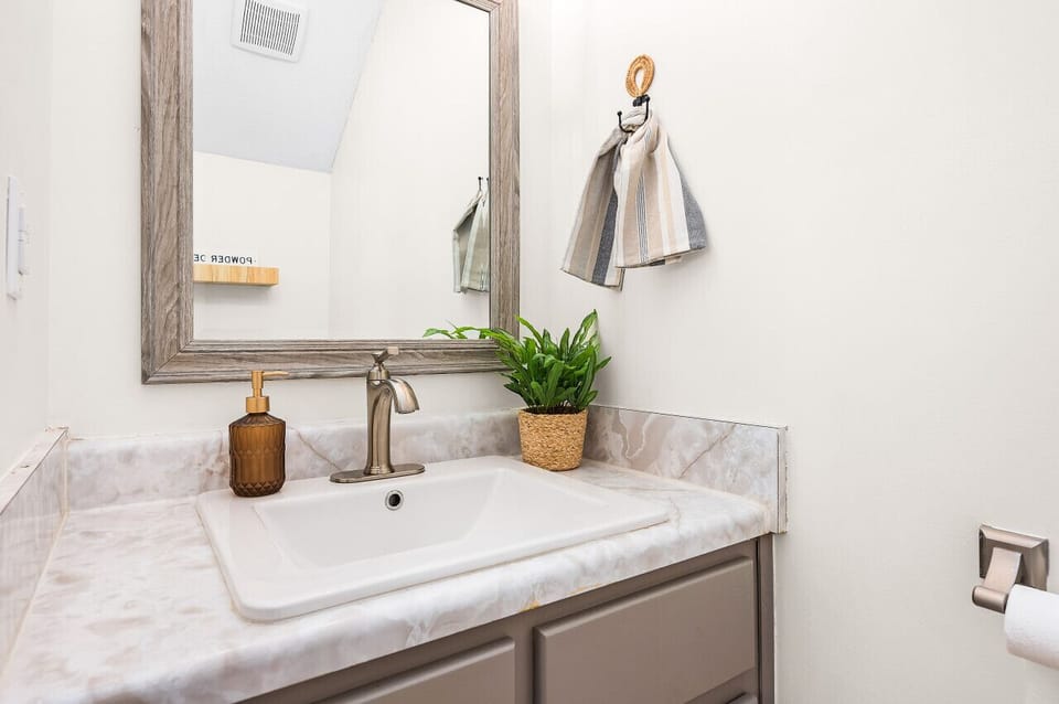 Elegance meets functionality in this beautifully designed powder room.