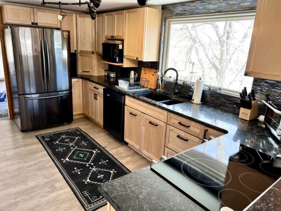 Fully stocked kitchen equipped with all new appliances & cookware by Cuisinart. 