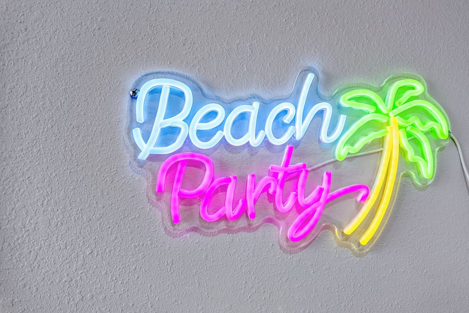 Neon Delight: Brighten your stay with vibrant beach vibes and playful decor!