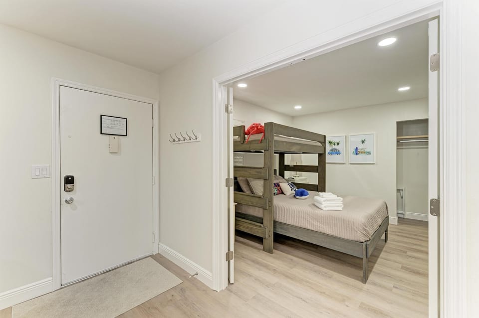 Front door looking into bunk room through large double doors
