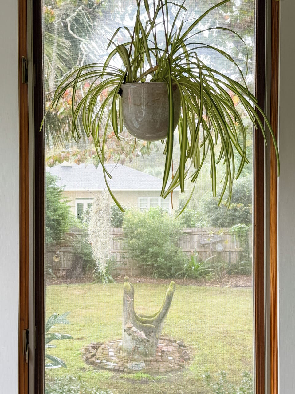 Views from the sun room to the East Garden.