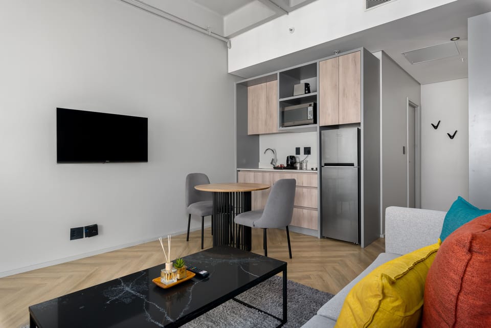 City Studio | Living area | 50-inch flat-screen TV with cable channels, TV, Netflix