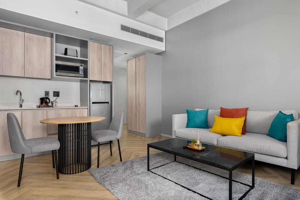 City Studio | Living area | 50-inch flat-screen TV with cable channels, TV, Netflix