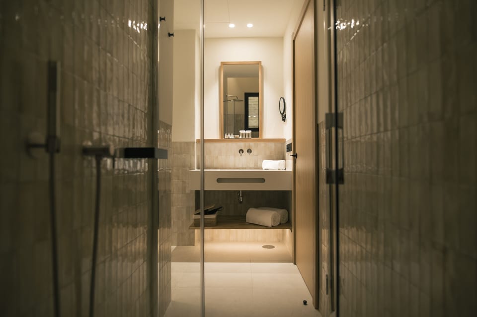 Eco-friendly toiletries, hair dryer, slippers, towels
