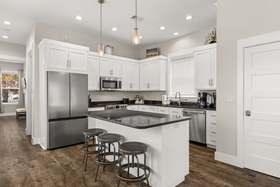 Spacious kitchen island with extra seating — perfect for breakfast before heading to the beach