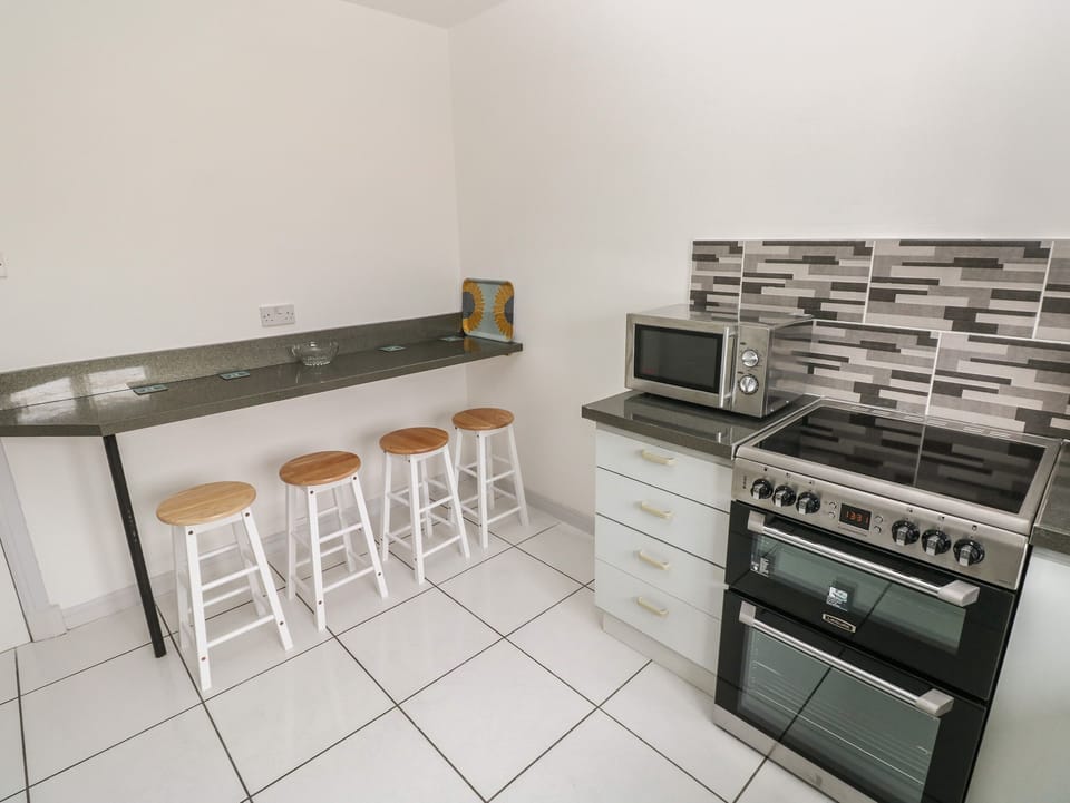 Fridge, electric kettle, toaster, cookware/dishes/utensils