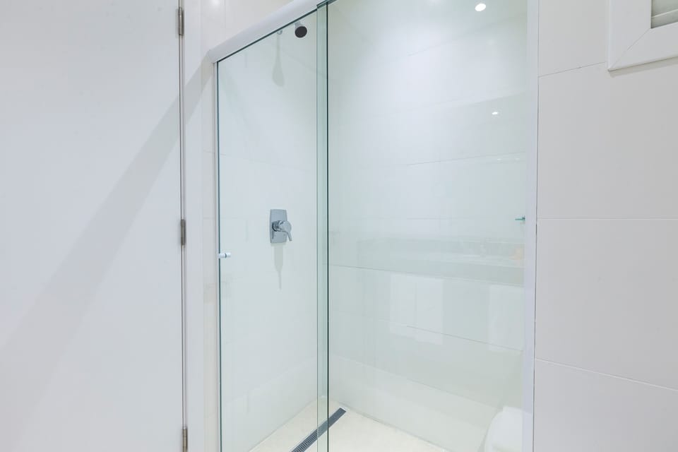 Shower, rainfall showerhead, designer toiletries, hair dryer