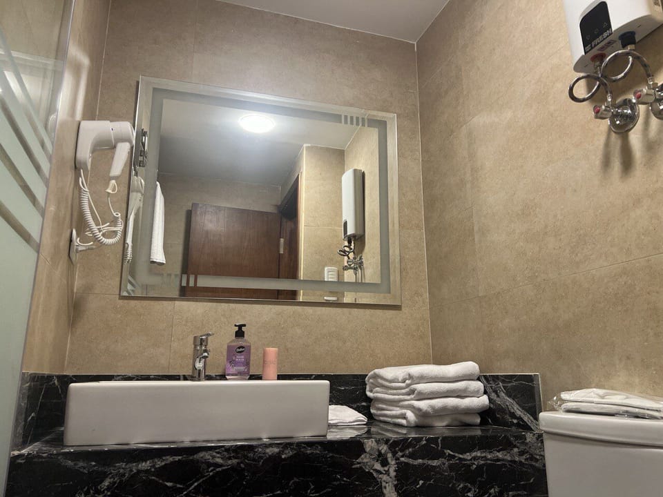Deluxe Double Room, 2 Bedrooms | Bathroom | Separate tub and shower, hair dryer, bidet, towels