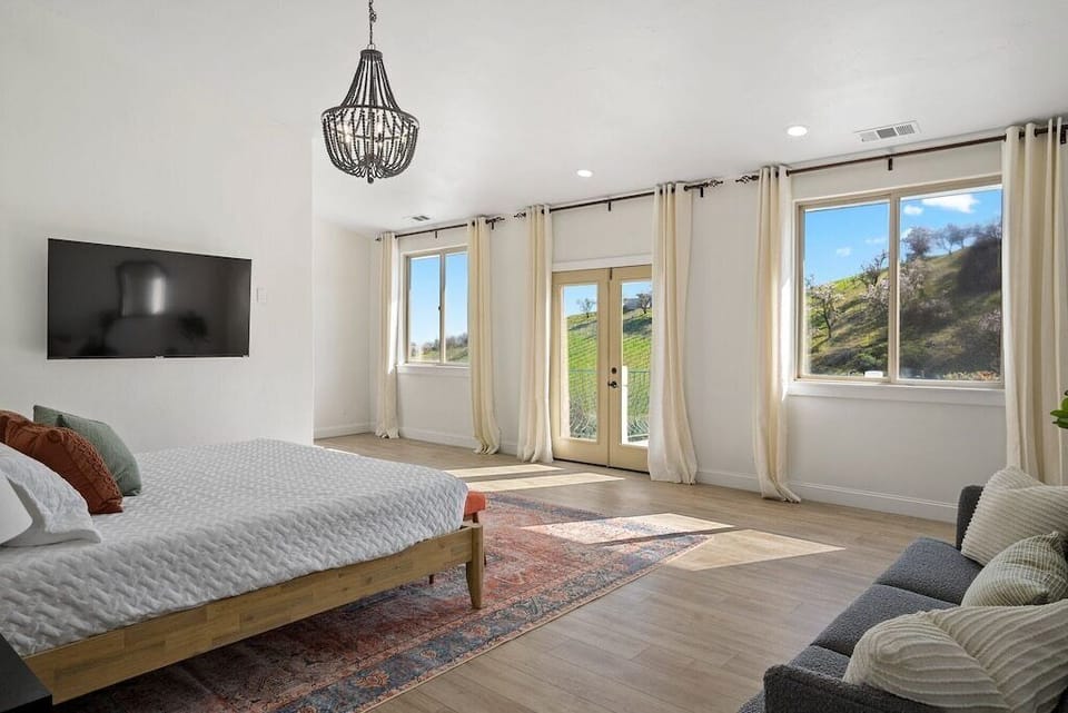 Upstairs primary suite with private balcony