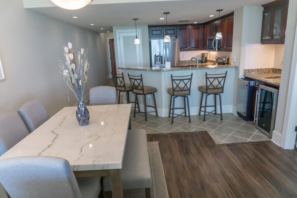 Bright dining area with cozy seating and modern kitchen bar