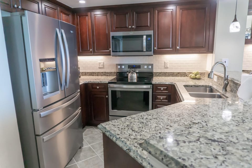 Modern kitchen with granite countertops and stainless steel appliances