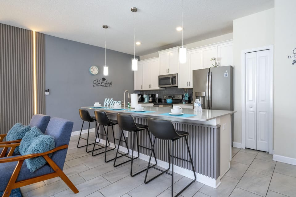 Modern kitchen with sleek island seating for gatherings