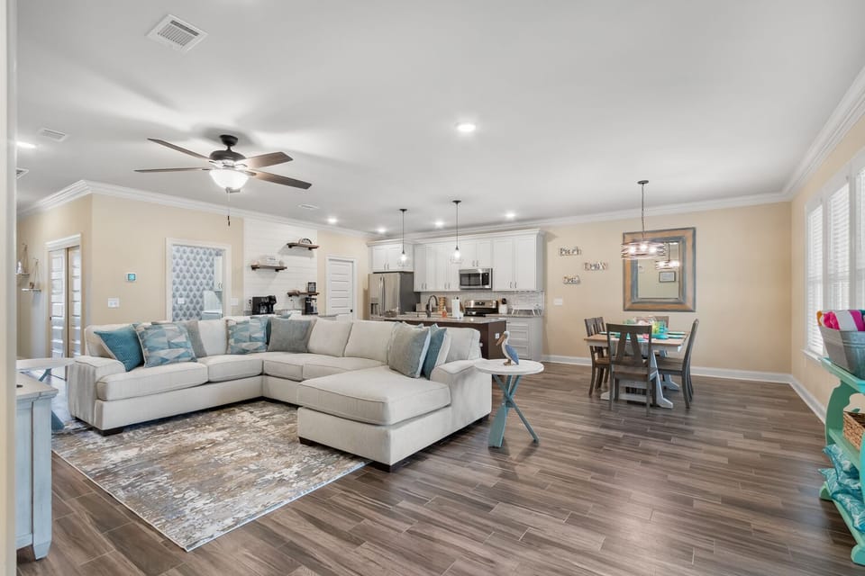Open concept living, dining and kitchen areas keeps the family together
