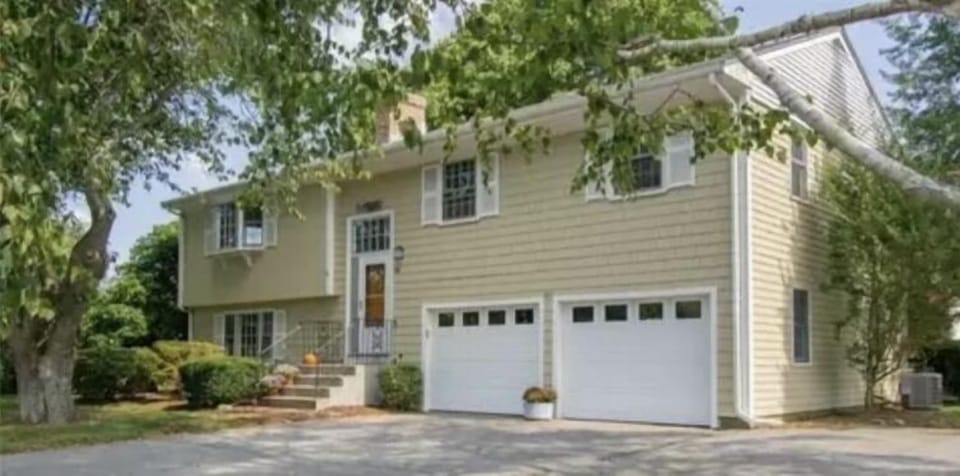 Front of the house /2 garages and parking lot