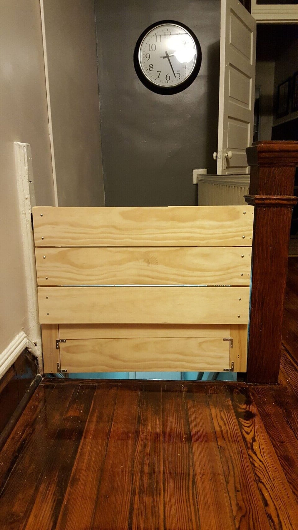 closed baby gate covering entrance stairway 