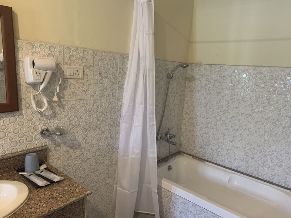 Rainfall showerhead, hair dryer, slippers, towels