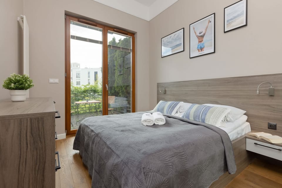 The cosy bedroom features a luxurious double bed and ample storage.