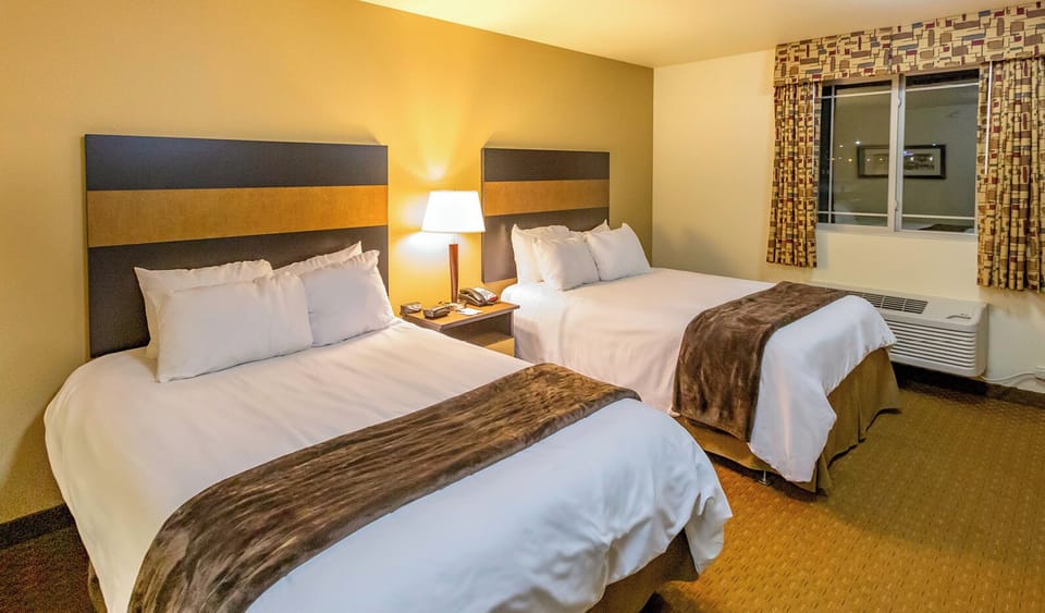 Premium bedding, pillowtop beds, desk, laptop workspace