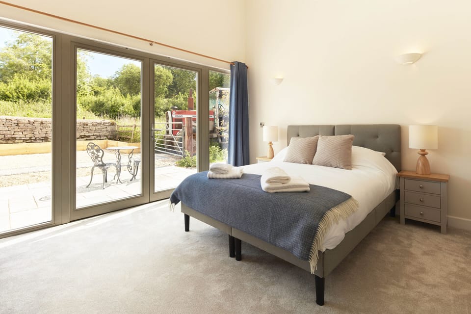 Large en suite bedroom with patio door