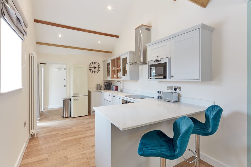 Well equipped kitchen with breakfast bar, dishwasher and espresso machine