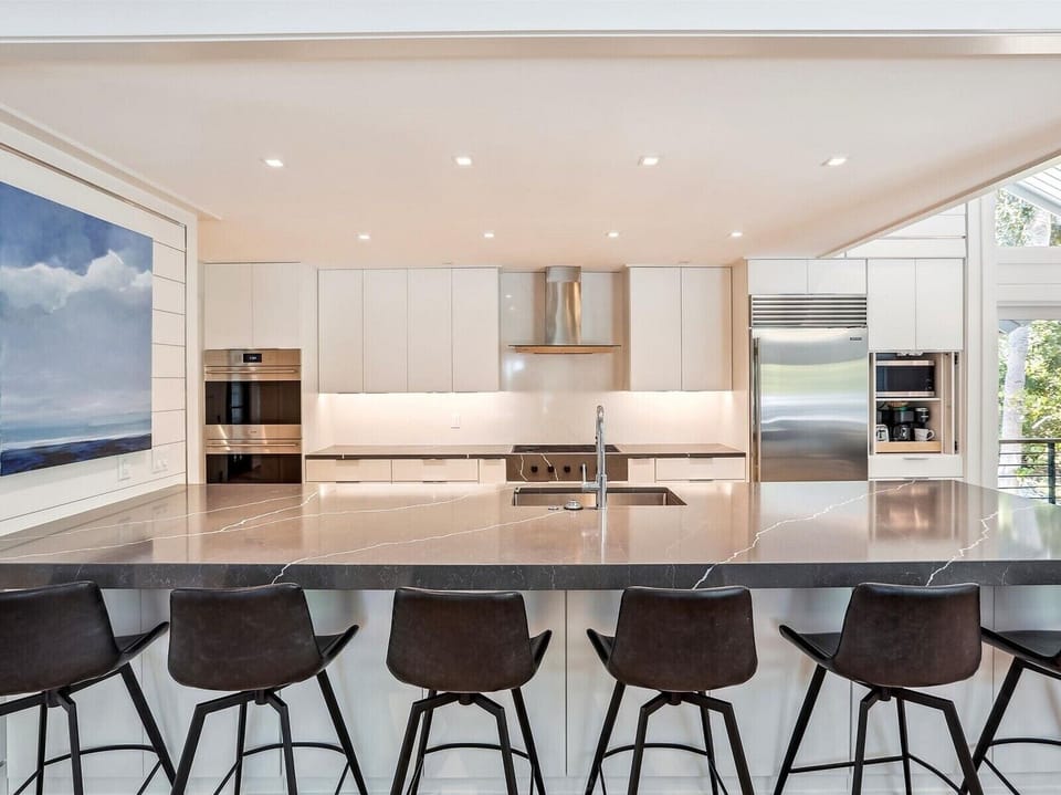 Chef’s kitchen with oversized island and premium finishes.