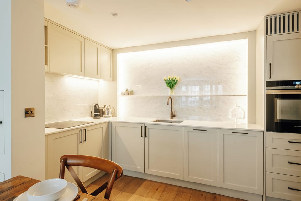Fully equipped kitchen with modern integrated appliances.