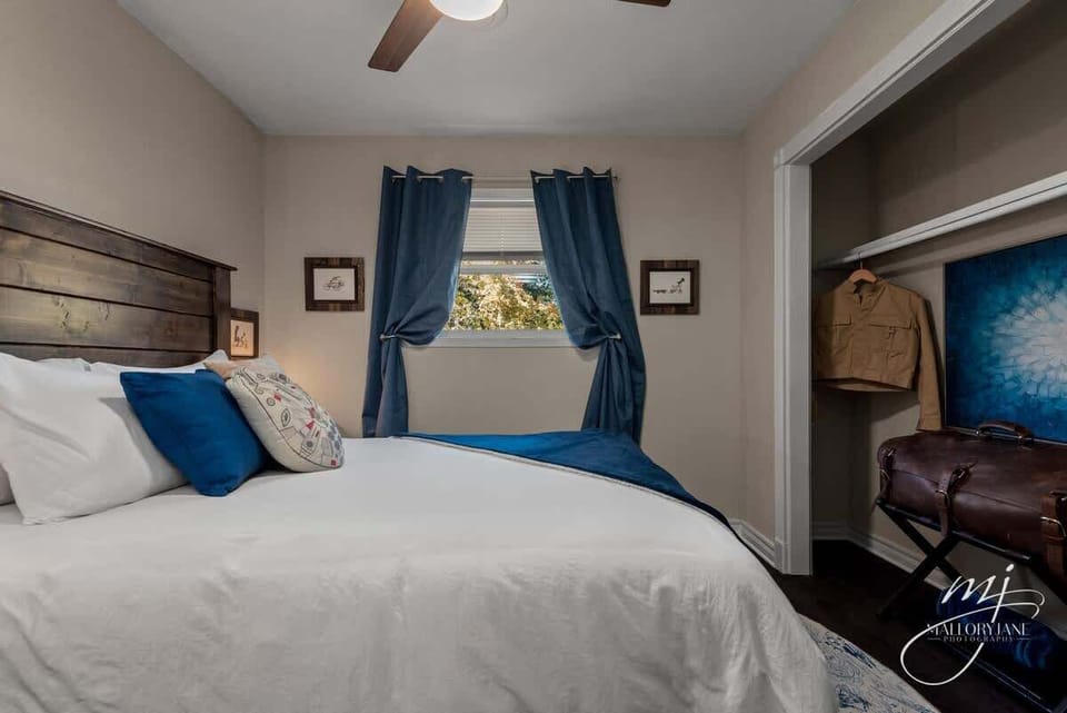 The fourth bedroom offers a comfy queen bed and a quiet reading nook for relaxation.