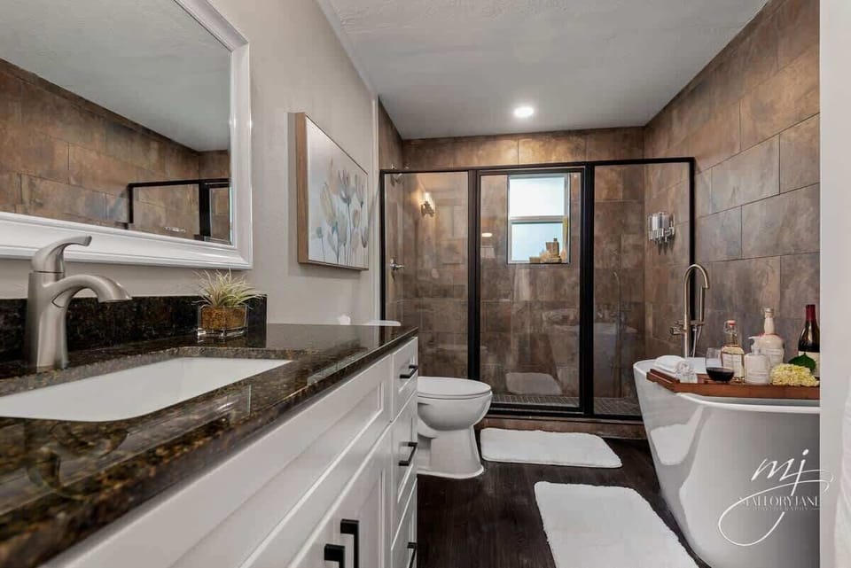 Pamper yourself in the spa‑like bathroom with rainfall shower, deep soaking tub, and fluffy towels.