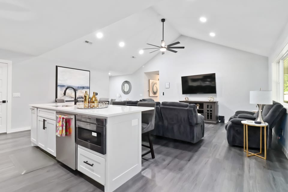 Sleek and sunlit kitchen and living
