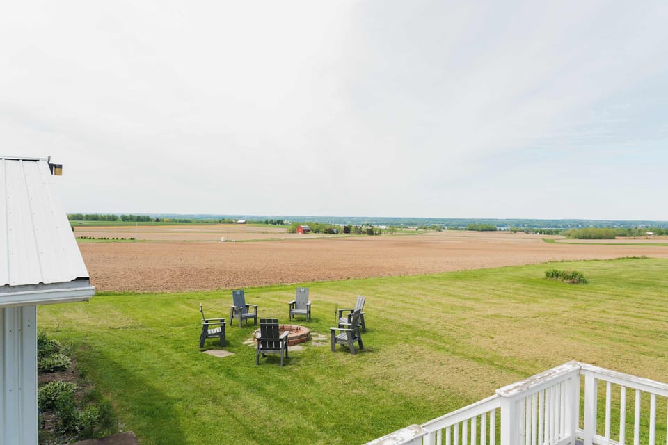 Beautiful backyard with expansive lawn and lake views.