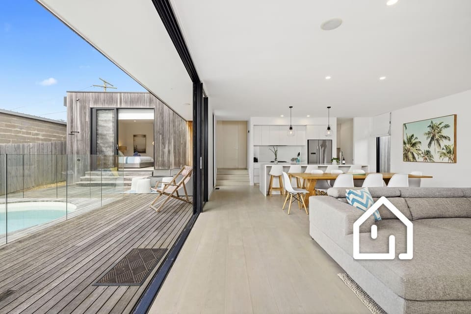 Beautiful open plan living opening via stacker doors to the deck and pool area