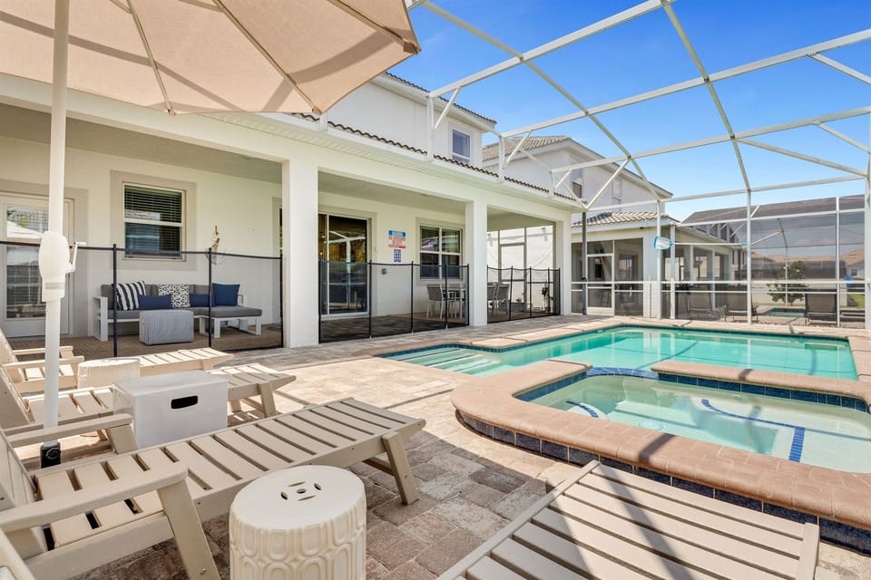 Imagine relaxing poolside with some wine in your very own screened-in private pool and spa.