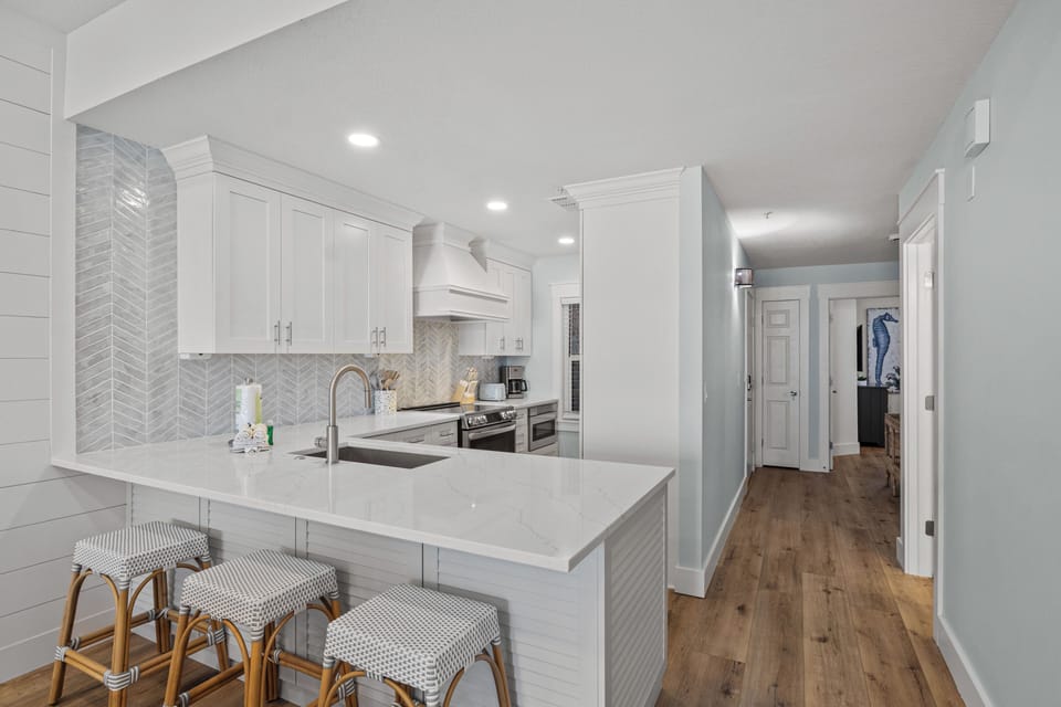 Nice and open kitchen with bar stools