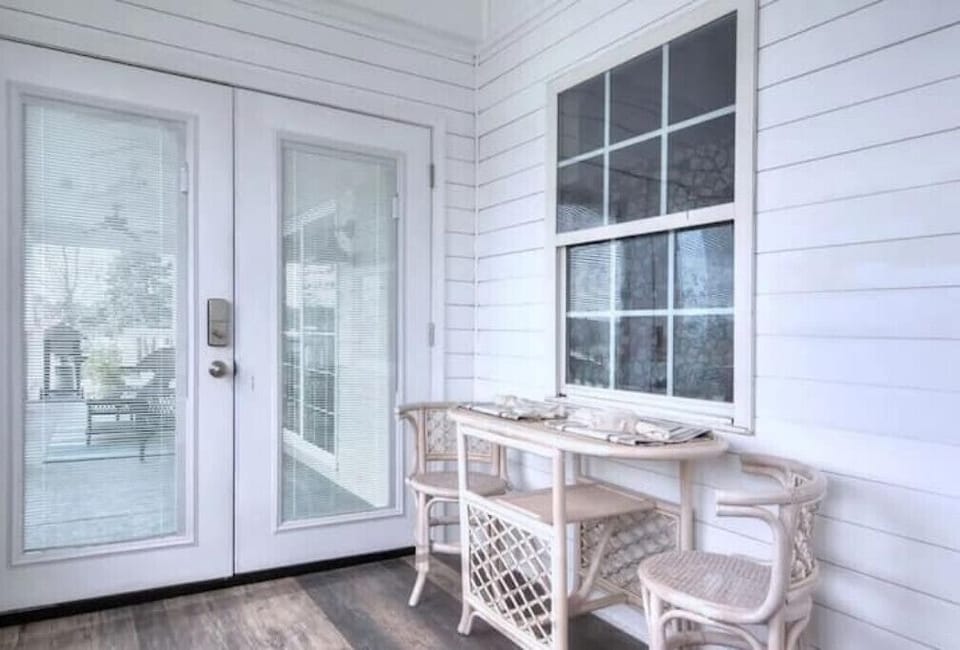 The sunroom is the perfect spot for morning coffee or utilizing as a home office
