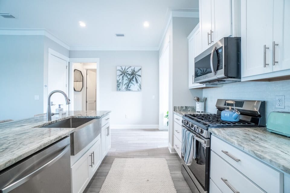 Kitchen: Bright and airy, this chic space invites culinary adventures with stylish seating!