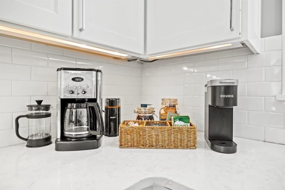 Coffee or tea? This beverage station features a Keurig complete with K-cups, a Cuisanart coffee brewer, and a French press for the true connoisseur. 