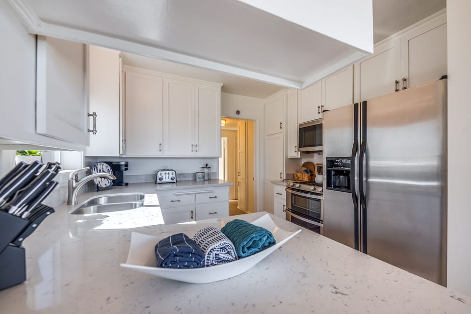 New countertops and cabinets in Kitchen with plenty of counter space for cooking