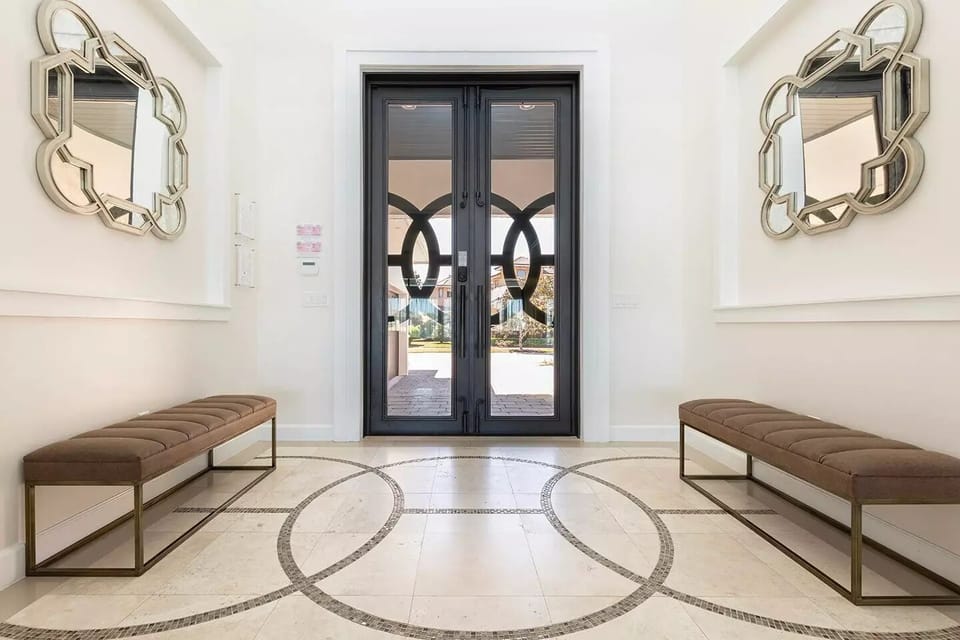 10 Foot Tall Iron & Glass Entry Doors & Marble Foyer.