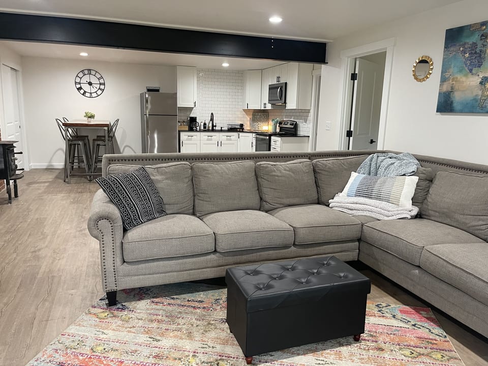 Open kitchen and living space with cozy sectional.