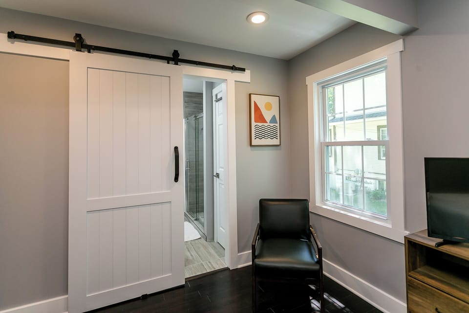 Barn door that leads to the bath