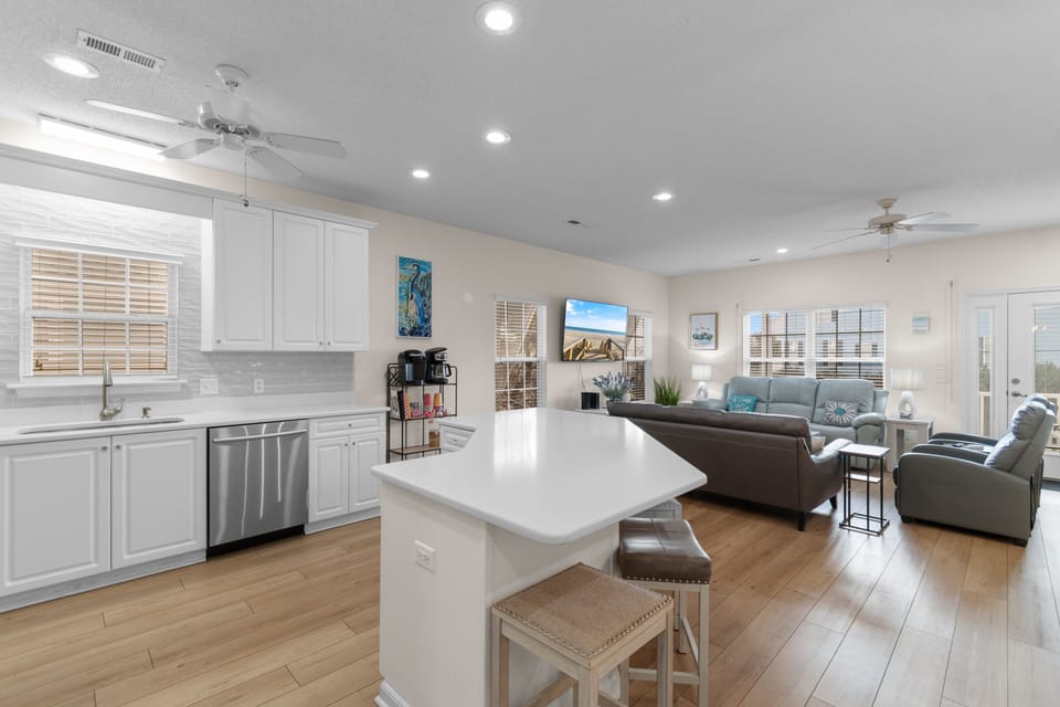 Relax in your bright, open-concept space where the modern kitchen flows seamlessly into your comfortable living area—perfect for unwinding after exploring.
